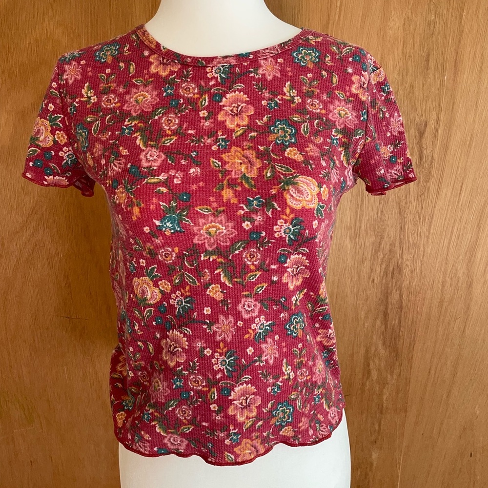 Dark pink floral top, ruffles at ends of sleeves and bottom of top, size S
